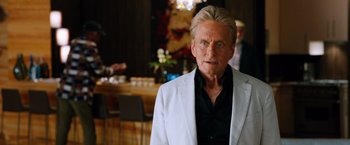 Movie still from “Last Vegas” (2013), directed by Jon Turteltaub – An older man wearing a white jacket and a black shirt; Close Up shot, Over the shoulder angle