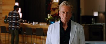 Movie still from “Last Vegas” (2013), directed by Jon Turteltaub – An older man in a white jacket standing in front of a table; Close Up shot, Over the shoulder angle