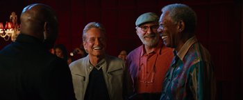 Movie still from “Last Vegas” (2013), directed by Jon Turteltaub – A group of men standing next to each other laughing; Medium shot, Low angle