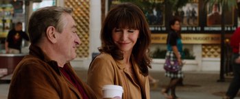 Movie still from “Last Vegas” (2013), directed by Jon Turteltaub – A woman in a brown jacket holding a cup of coffee; Close Up shot, Over the shoulder angle