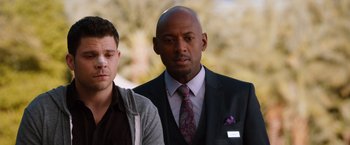 Movie still from “Last Vegas” (2013), directed by Jon Turteltaub – A man in a suit standing next to another man in a suit; Close Up shot, Over the shoulder angle