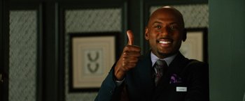 Movie still from “Last Vegas” (2013), directed by Jon Turteltaub – A man in a suit giving a thumbs up; Close Up shot, Low angle