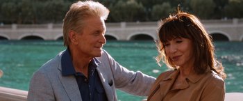 Movie still from “Last Vegas” (2013), directed by Jon Turteltaub – A man and a woman standing next to each other near a body of water; Close Up shot, Over the shoulder angle
