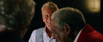 Movie still from “Last Vegas” (2013), directed by Jon Turteltaub – An older man smiling at the camera while another older man looks on; Close Up shot, Over the shoulder angle