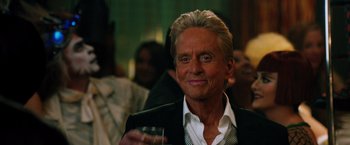 Movie still from “Last Vegas” (2013), directed by Jon Turteltaub – A person holding a glass of wine; Close Up shot, Over the shoulder angle
