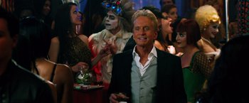 Movie still from “Last Vegas” (2013), directed by Jon Turteltaub – A man in a crowd of people at an event; Close Up shot, Over the shoulder angle