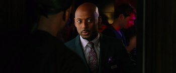 Movie still from “Last Vegas” (2013), directed by Jon Turteltaub – A man wearing a suit and tie talking to another man; Close Up shot, Over the shoulder angle