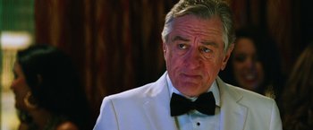Movie still from “Last Vegas” (2013), directed by Jon Turteltaub – An older man wearing a tuxedo and a bow tie; Close Up shot, Over the shoulder angle
