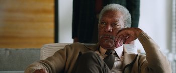 Movie still from “Last Vegas” (2013), directed by Jon Turteltaub – An older man sitting on a couch with his hand under his chin; Close Up shot, Over the shoulder angle