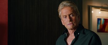Movie still from “Last Vegas” (2013), directed by Jon Turteltaub – An older man with blonde spiky hair wearing a black shirt; Close Up shot, Over the shoulder angle