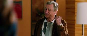 Movie still from “Last Vegas” (2013), directed by Jon Turteltaub – A man in a brown jacket and a tie; Close Up shot, Low angle