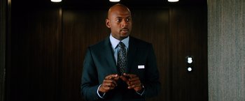 Movie still from “Last Vegas” (2013), directed by Jon Turteltaub – A man in a suit and tie talking to a crowd of onlookers; Close Up shot, Low angle