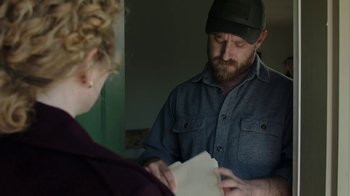 Movie still from “Leave No Trace” (2018), directed by Debra Granik – A man and a woman looking at a piece of paper; Medium shot, Over the shoulder angle