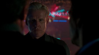 Movie still from “Lethal Weapon” (1987), directed by Richard Donner – A person wearing a black shirt; Close Up shot, Over the shoulder angle