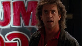Movie still from “Lethal Weapon” (1987), directed by Richard Donner – A person wearing a jacket; Close Up shot, Low angle