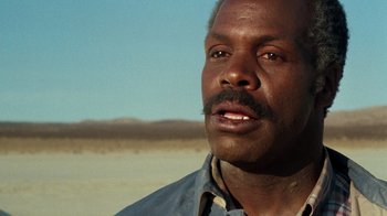 Movie still from “Lethal Weapon” (1987), directed by Richard Donner – A person with a mustache; Close Up shot, Low angle
