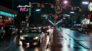 Movie still from “Lethal Weapon” (1987), directed by Richard Donner – A street filled with lots of traffic at night time; Extreme Wide shot, Low angle