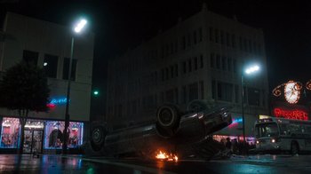 Movie still from “Lethal Weapon” (1987), directed by Richard Donner – A car that is sitting on the side of the road; Extreme Wide shot, Low angle