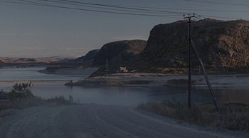 Movie still from “Leviathan” (2014), directed by Andrey Zvyagintsev – A view of a river with a bridge in the background; Extreme Wide shot, High angle