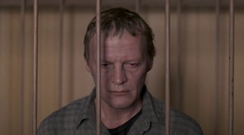 Movie still from “Leviathan” (2014), directed by Andrey Zvyagintsev – A man in a jail cell with his eyes wide open; Close Up shot, High angle