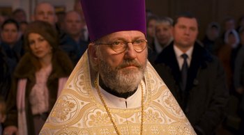Movie still from “Leviathan” (2014), directed by Andrey Zvyagintsev – An older man wearing a purple hat and glasses; Close Up shot, Low angle