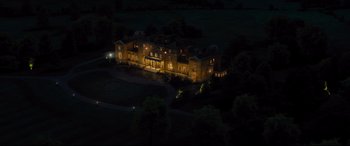 Movie still from “Kingsman: The Golden Circle” (2017), directed by Matthew Vaughn – An aerial view of a large mansion at night; Extreme Wide shot, High angle