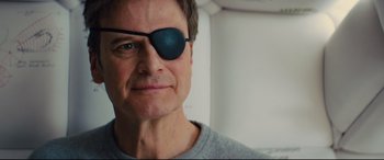 Movie still from “Kingsman: The Golden Circle” (2017), directed by Matthew Vaughn – A person wearing a eye patch; Close Up shot, Low angle