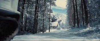 Movie still from “Kingsman: The Golden Circle” (2017), directed by Matthew Vaughn – A house in the middle of the woods covered in snow; Extreme Wide shot, High angle