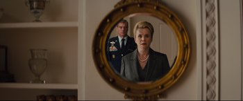 Movie still from “Kingsman: The Golden Circle” (2017), directed by Matthew Vaughn – A man and a woman are looking in a mirror; Medium shot, Over the shoulder angle