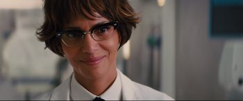 Movie still from “Kingsman: The Golden Circle” (2017), directed by Matthew Vaughn – A person wearing glasses and a white shirt; Close Up shot, Low angle