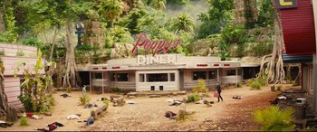 Movie still from “Kingsman: The Golden Circle” (2017), directed by Matthew Vaughn – An abandoned diner in the middle of the jungle; Extreme Wide shot, High angle