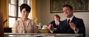 Movie still from “Licorice Pizza” (2021), directed by Paul Thomas Anderson – A group of people sitting at a dining table; Medium shot, Over the shoulder angle