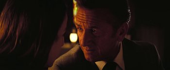 Movie still from “Licorice Pizza” (2021), directed by Paul Thomas Anderson – A person wearing a suit and tie; Close Up shot, Over the shoulder angle