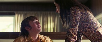 Movie still from “Licorice Pizza” (2021), directed by Paul Thomas Anderson – A man and a woman talking to each other; Close Up shot, Over the shoulder angle