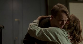 Movie still from “Life After Beth” (2014), directed by Jeff Baena – A man hugging another man with his arms around him; Close Up shot, Over the shoulder angle