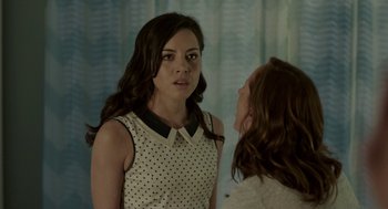 Movie still from “Life After Beth” (2014), directed by Jeff Baena – A woman standing next to another woman in front of a window; Close Up shot, Over the shoulder angle