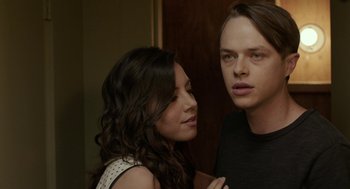 Movie still from “Life After Beth” (2014), directed by Jeff Baena – A man and a woman standing next to each other in a room; Close Up shot, Over the shoulder angle