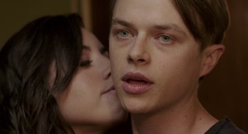 Movie still from “Life After Beth” (2014), directed by Jeff Baena – A man and a woman kissing in front of each other; Close Up shot, Over the shoulder angle