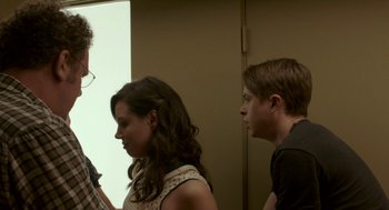 Movie still from “Life After Beth” (2014), directed by Jeff Baena – A man and a woman standing next to each other in a room; Medium shot, Over the shoulder angle