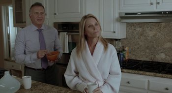 Movie still from “Life After Beth” (2014), directed by Jeff Baena – A man and a woman are standing in a kitchen; Medium shot, Over the shoulder angle