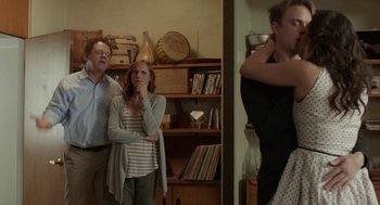 Movie still from “Life After Beth” (2014), directed by Jeff Baena – A man and a woman standing next to each other in a room; Medium shot, Over the shoulder angle