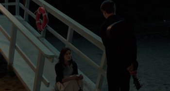 Movie still from “Life After Beth” (2014), directed by Jeff Baena – A woman sitting on a bench next to a man; Wide shot, High angle