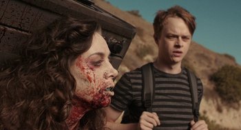 Movie still from “Life After Beth” (2014), directed by Jeff Baena – A man and a woman with blood all over their face; Close Up shot, Over the shoulder angle