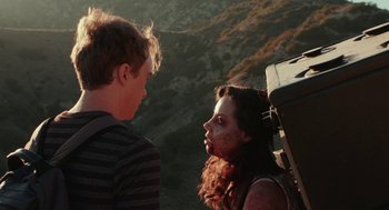 Movie still from “Life After Beth” (2014), directed by Jeff Baena – A man and a woman dressed up as zombies; Medium shot, Over the shoulder angle