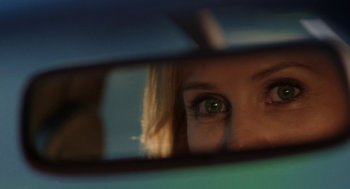 Movie still from “Life After Beth” (2014), directed by Jeff Baena – A person's eyes in a car mirror; Extreme Close Up shot, Over the shoulder angle