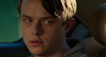 Movie still from “Life After Beth” (2014), directed by Jeff Baena – A man's face in the sunlight; Close Up shot, Over the shoulder angle
