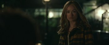 Movie still from “Life Itself” (2018), directed by Dan Fogelman – A woman with long blonde hair wearing a plaid shirt; Close Up shot, Over the shoulder angle