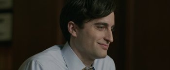 Movie still from “Life Itself” (2018), directed by Dan Fogelman – A person wearing a shirt and tie; Close Up shot, Over the shoulder angle