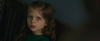 Movie still from “Life Itself” (2018), directed by Dan Fogelman – A little girl sitting in front of a blue wall; Close Up shot, High angle