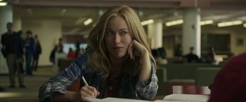 Movie still from “Life Itself” (2018), directed by Dan Fogelman – A woman sitting at a table with her hand on her head; Close Up shot, Over the shoulder angle